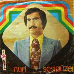 NURİ SESİGÜZEL BENDEN AYRI GEZERSEN  BİR LOKMA EKMEK PEŞİNDE